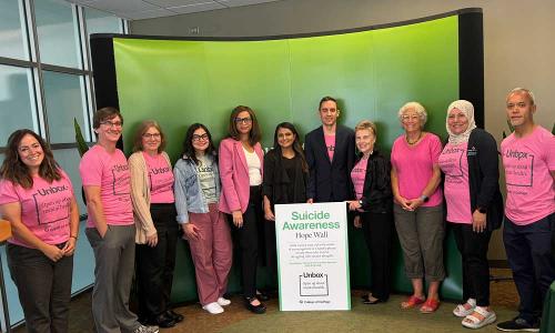 Group of people wearing pink shirts 