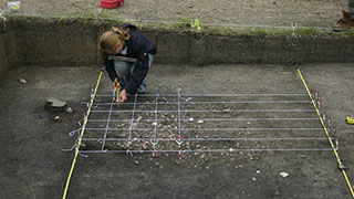 student surveying land