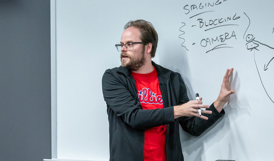 Brian Brems teaching at a whiteboard