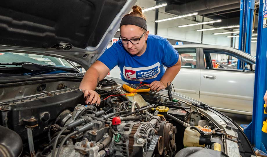 Mechanic working under the hood of a car