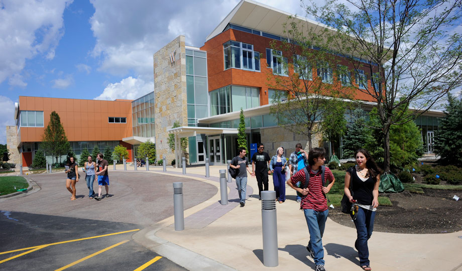 students walk outside the CHC building