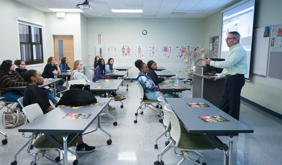 high school students sit in an anatomy classroom during lecture