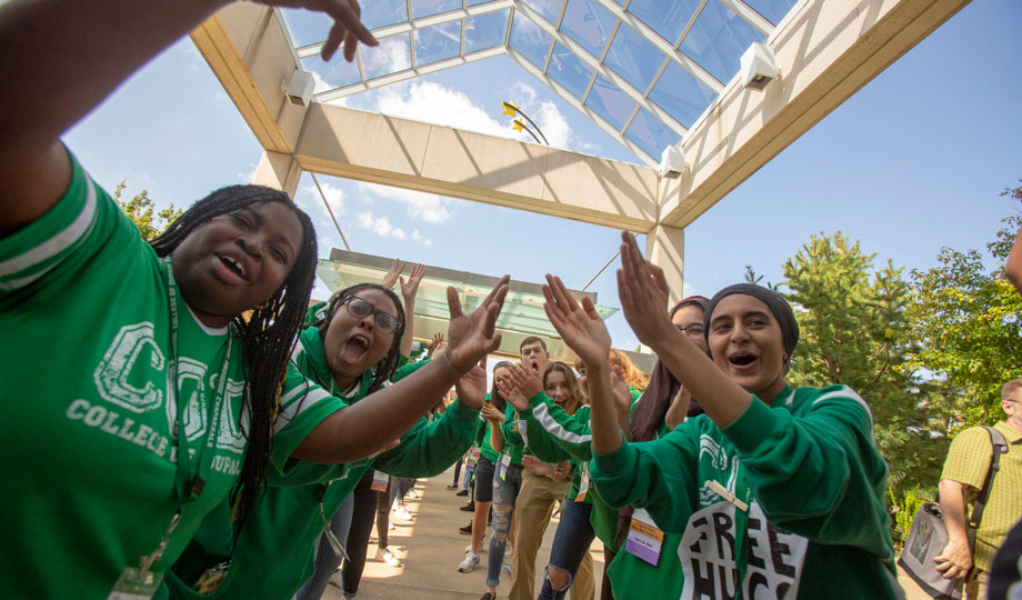 Students cheering and welcoming guests during last years' fall New Student Orientation.