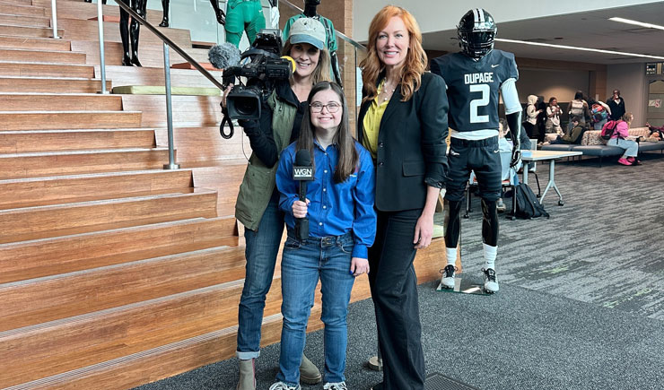 Lily Goodfellow standing with two WGN reporters