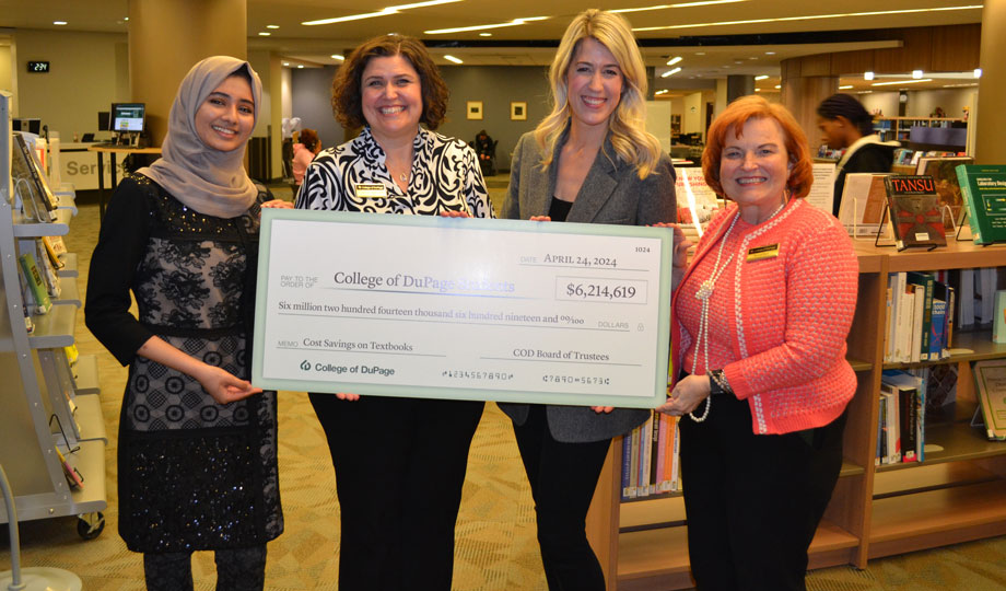 four women hold a large check for six million to go towards open educational resources