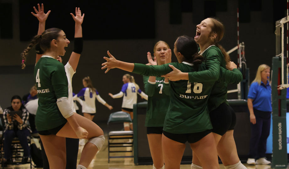 COD women's volleyball team celebrate on the court after a victory