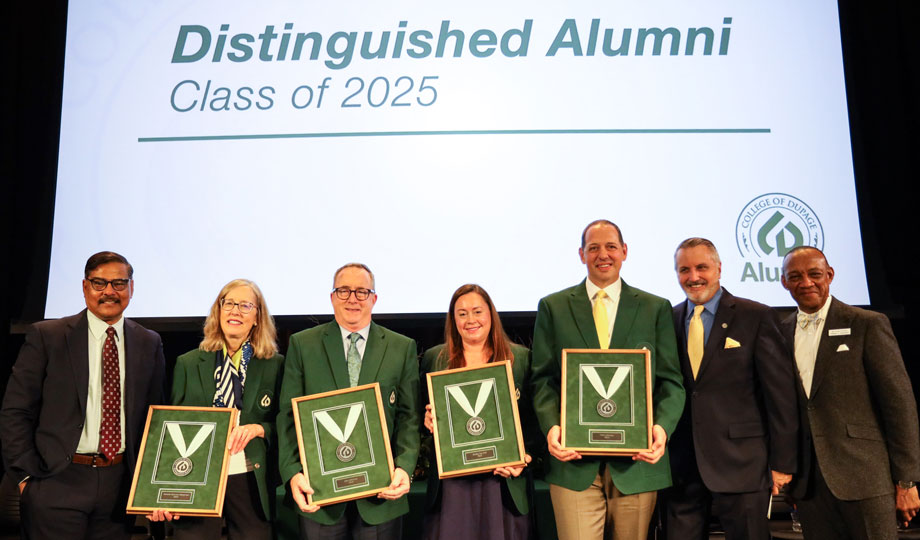 Distinguished alumni standing with president of COD.