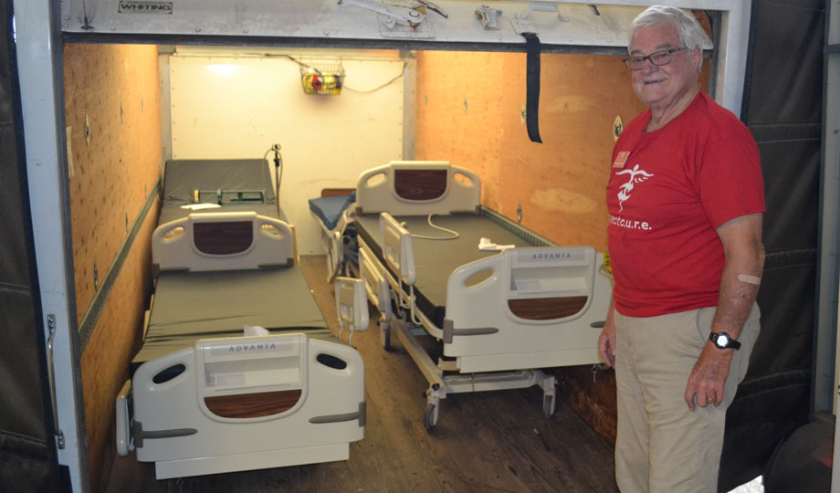 Project C.U.R.E. volunteer Mark Jostrom with COD donations.