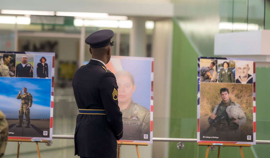 soldier looking at photo exhibit
