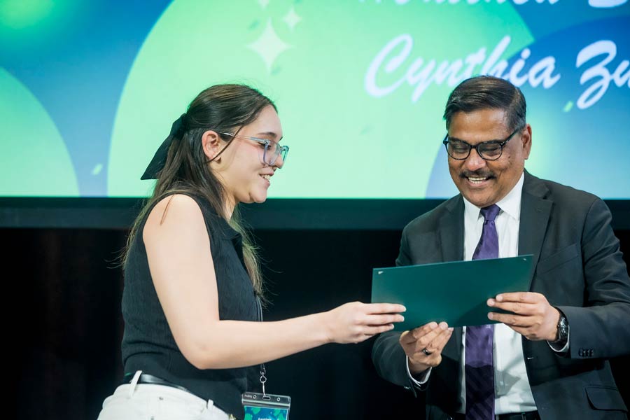 Dr. Siddiqi gives award to Celebration of Academic Excellence honoree Justina Rodriguez Carrozzo