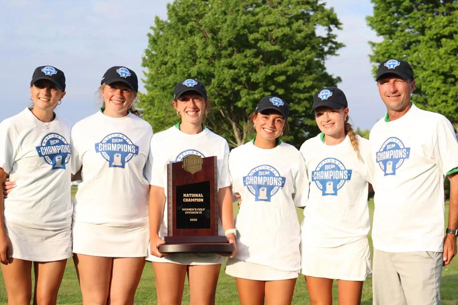 COD Women's Golf team with championship plaque.