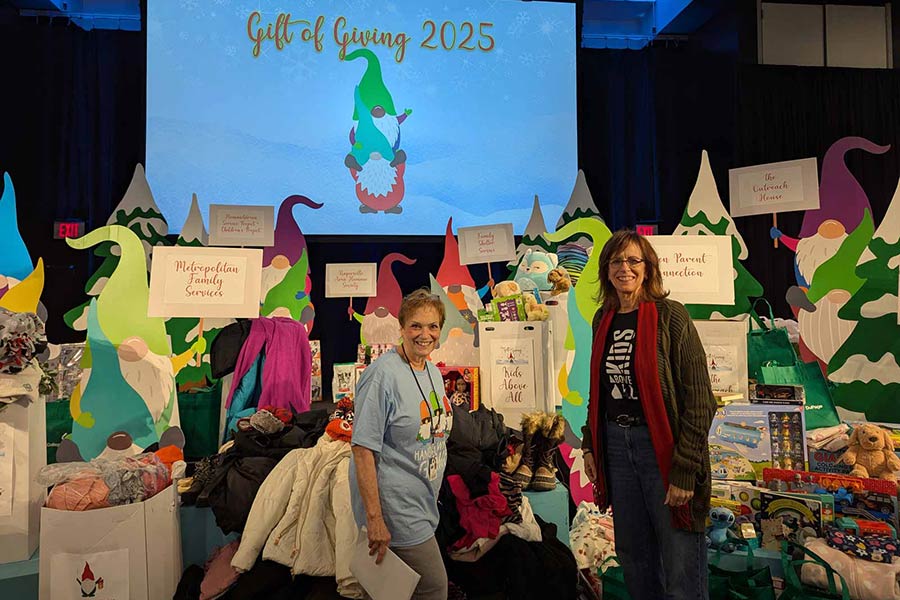 two women posting at Gift of Giving event
