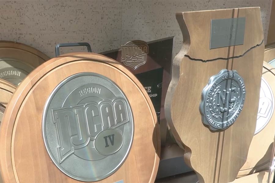 two wood and silver NJCAA trophies