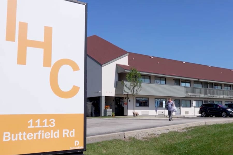 IHC sign with building in background