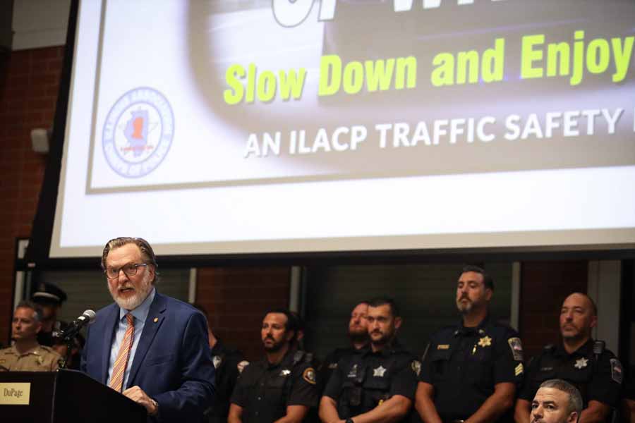 Joe Cassidy speaking in front of police officers