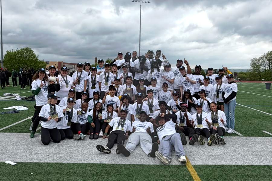 Men's and Women's Track teams posing with national title.